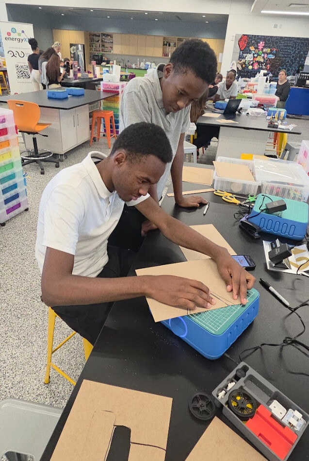 Students building with cardboard and SAM Labs electronics kit